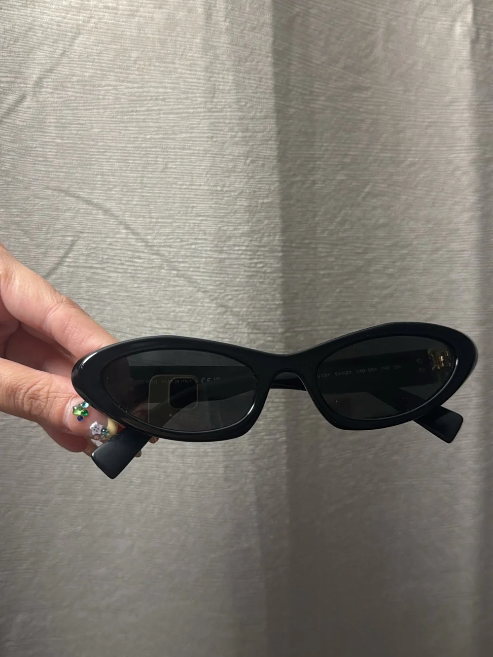 Miu Miu Black Cat-Eye Sunglasses with Gold Logo Accents